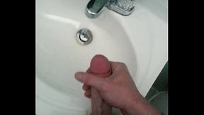 Dick slapping pain fun in the bathroom