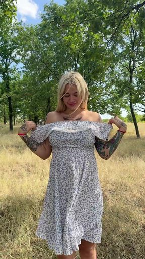 Busty babe shows off her big tits in the great outdoors