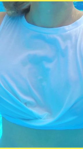Wifey goes for a swim in a white shirt braless which shows her perfect tits in the water   Clip 1