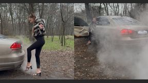 The Volkswagen makes a lot of smoke. Nastya warms her feet near the exhaust pipe.
