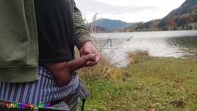 Pissing outdoor by a mountain lake, then I jerk off my shaved, foreskin cock.