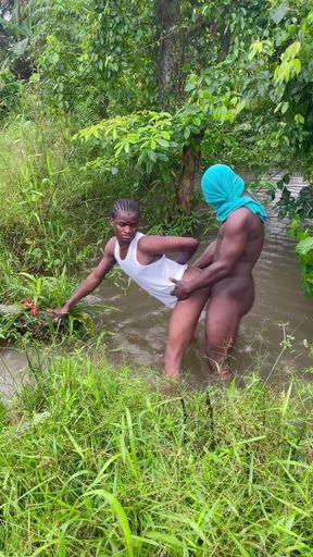 Sex Inside a Swampy River Rounded by Wild Bushes