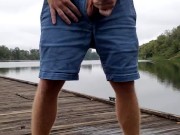 Redbull piss outside at the river, on the dock