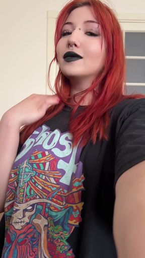 Gothic red-haired woman in black t-shirt