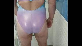 Boy in shiny swimsuit