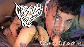 Wet and messy kitty plays with his cake