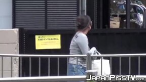 Japanese with big boobs peeing on parking and later in