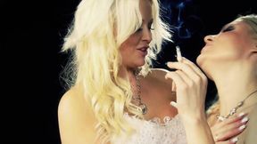 Blonde MILFs touch each other and kiss while holding cigarettes