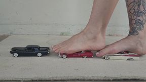Giantess goddess Charlie Caroline Crushes 3 classic American cars BARE FOOT with painted toenails and finishes them off in sandals close ground view