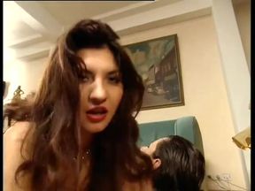 Omg! Busty Brunette in Latex Gets Fucked by Two Guys on Couch