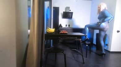 Curvy MILF in blue latex catsuit backstage solo tease