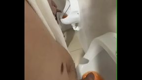 Filming the guy peeing next to me at the urinal of the pool toilets