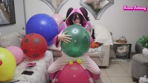 Juri blows up balloons while bouncing on space hopper, with deflation