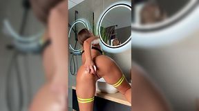Hot MILF in sexy lingerie penetrates her anal in a bathroom