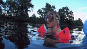 Alla wears a diving mask and inflatable armbands for safety and swims on the lake!!!
