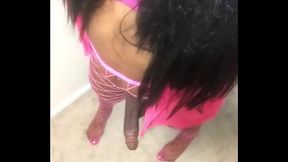 Ebony Black Tranny In Pink Swings Cock