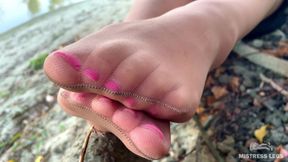 My Cute Feet in Nude Tights Rub Against Each Other on the Autumn River Bank