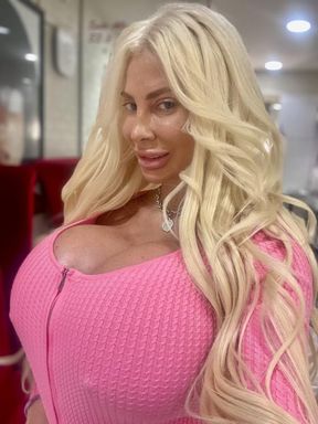 Pink zipper top and black vinyl pants
