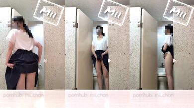 Japanese girl furiously masturbates in a crowded public toilet