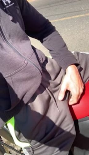 Beautiful hairy huge dick in shorts without underwear on the bike