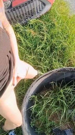 Redhead Pissssing on Tire Country Road in Black Dress.