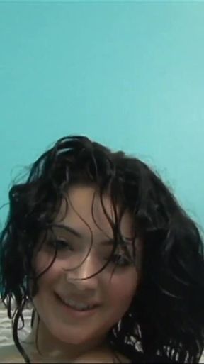 Tattooed brunette Andrea Kelly fucks her horny hairy pussy alone