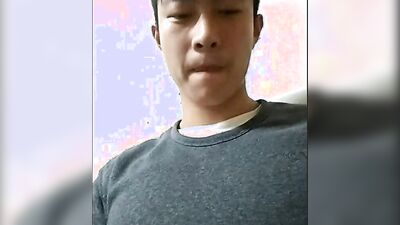 Handsome Asian jock shows his body and strokes his cock