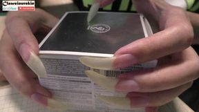 Scratching the carton with long nails