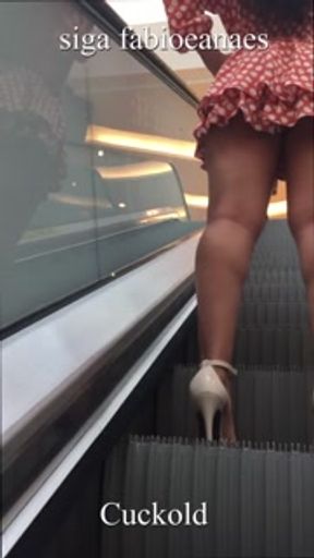 Hot naughty hotwife shows off in the mall parking lot for cuckold, walking in catwalk style mini ski