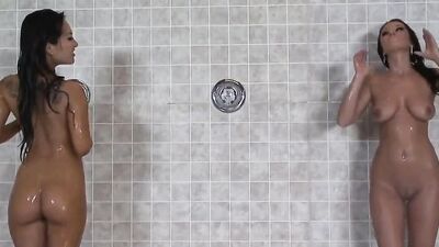 Gorgeous lesbian Asian cutie licking and dildoing her arousingly slutty busty friend in the showers