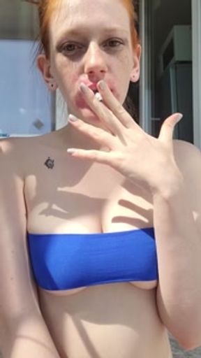smoking redhead with ruined makeup