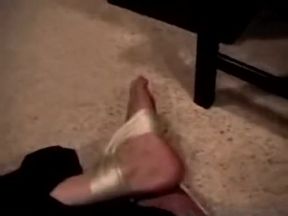 guy hogtied barefoot