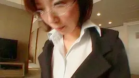 Short haired japanese office lady with glasses is posing indoors