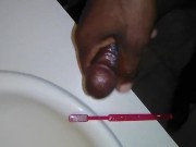 Cumming on toothbrush.