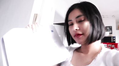 Thai student on her knees sucking her neighbor’s kinky cock in the kitchen