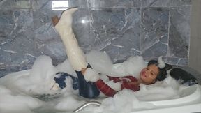 Underwater and Welook in jeans and boots in the bathtub