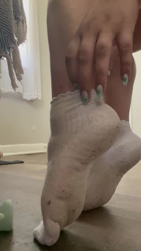 Sweaty girlfriend peels off her damp socks near you