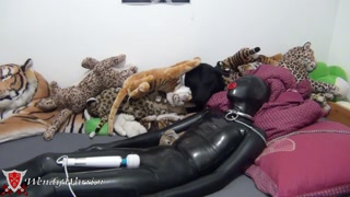 Chained and locked in Condom Catsuit