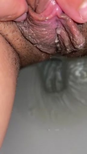Close up of my pussy while I masturbate and pee