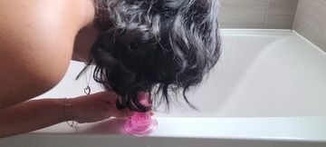 MILF gives herself pleasure in bathroom