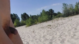 Twink boy found again a filled up condom while nude beach cruising so he put his dick in it &amp; loaded