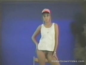 A slender blonde dances then masturbates