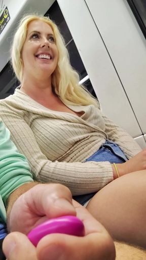 Public babe teases with remote control and big natural tits