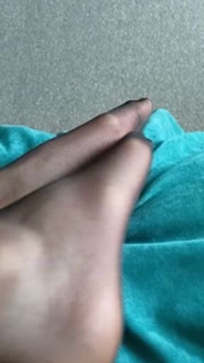 Black stockings tease with red pedicure on long toes. If you like legs and feet, enjoy it!