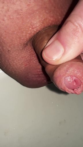 Captivating moment from &quot;play with the foreskin of my micro cock while peeing&quot;