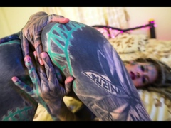 Tattooed girl fingering her pussy and ass
