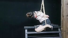 Chinese Model Sitting On A Iron Bar