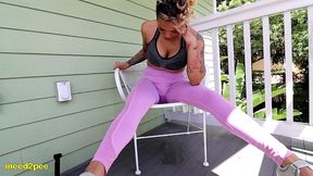 loosey lu wetting pink yoga pants on balcony