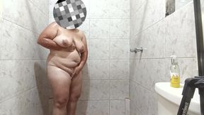 Sexy Latin girl touches herself very rich while showering rich and has giant breasts.