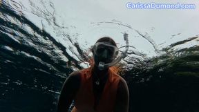 Carissa in the orange diveskin in the spring freediving part 2